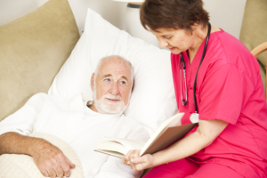 caregiver monitoring the health of the senior man