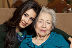 caregiver and senior woman smiling